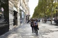 French people and foreigner travlers walking visit and shopping at sidewalk in LÃ¢â¬â¢avenue des Champs-Elysees